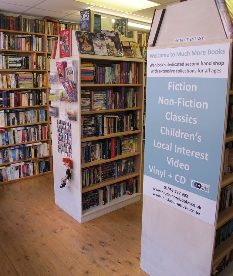 Inside Much More Books: pine shelves packed with secondhand books at 6 High Street, Much Wenlock